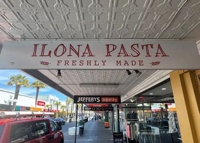 The red ILONA PASTA, FRESHLY MADE sign under a pressed-tin verandah on Emerson Street